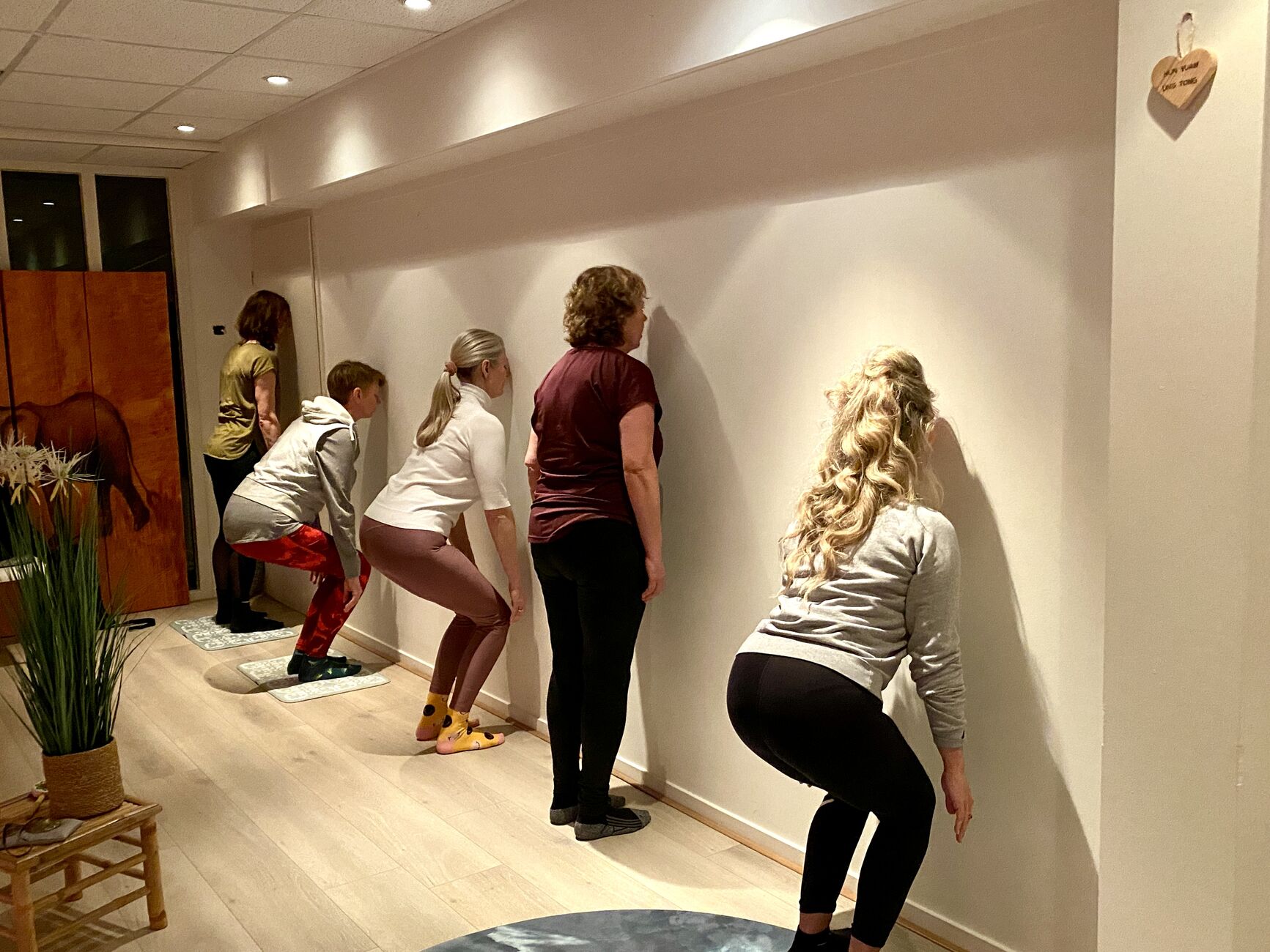 Wall squats against the studio wall